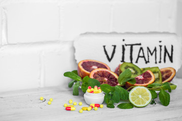 pills vitamins and fruits