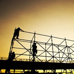 Construction workers working on scaffolding