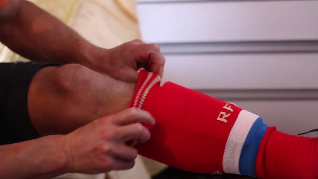  Soccer equipment. Soccer Shin Guards. Soccer Socks. Soccer Player In Dressing Room