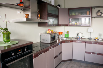 Modern kitchen interior made in brown tones