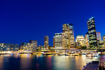 Fototapeta na wymiar Sydney skyline and Circular Quay ferry station at night
