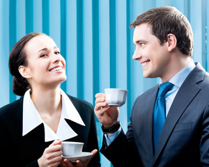 Businesspeople with coffee at office