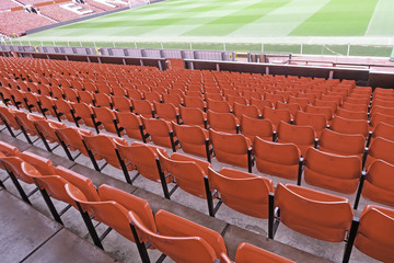 Red seats at football stadium.