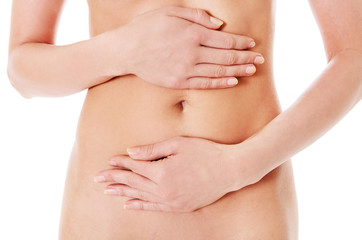 Body care, pregnancy diet concept, woman holding hands on the stomach.