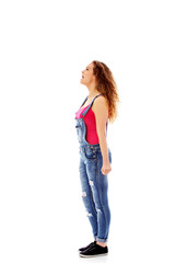 Angry screaming young woman with clenched fist