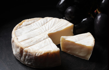 brie cheese with black grape