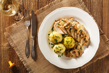 Roasted chicken breast served in a mushroom chanterelle sauce.