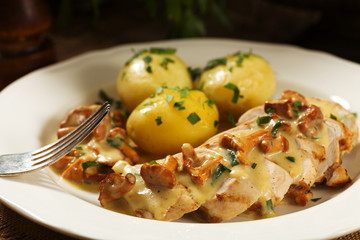 Roasted chicken breast served in a mushroom chanterelle sauce.