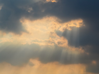 The sun hiding behind the clouds , Used as background