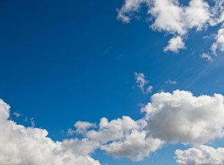White clouds in the blue sky.
