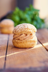 Baked sweet cakes on a wooden table.