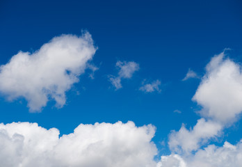 White clouds in the blue sky.