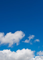 White clouds in the blue sky.