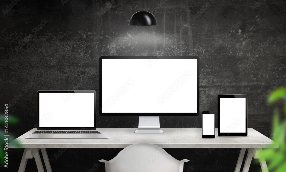 Poster Different devices on desk with isolated screen for responsive web site design promotion. Computer display, laptop, tablet and smart phone mockup.