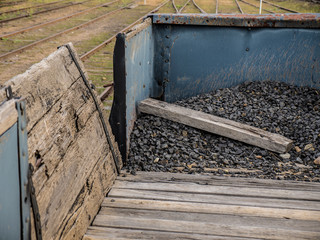 Track ballast rocks in the back of old vintage train carriage
