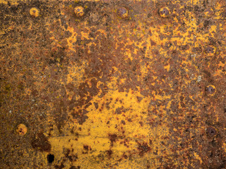 Old rusted yellow vintage train carriage wall, close detail and texture