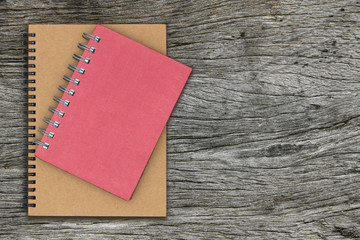 notebook with spiral binder on wooden table