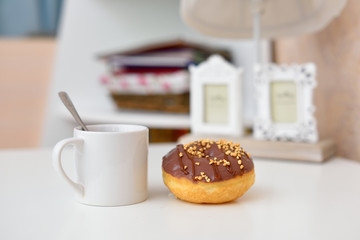 A cup of tea and donut