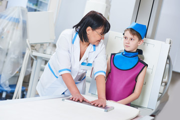 Nurse assistant with little boy preparing or x-ray radiography