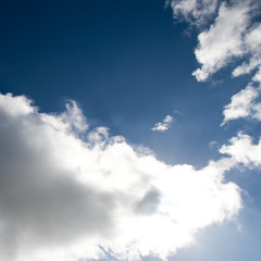 White clouds in the blue sky.