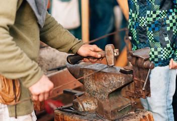 work of a blacksmith on the anvil