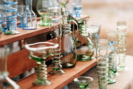 lot of glassware handmade on the table of green glass