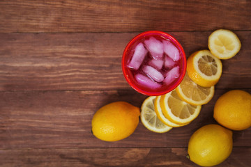 homemade lemonade with ice on a wooden table