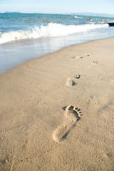 Footprints on the sand beach