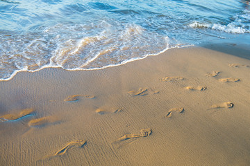 Footprints on the sand beach