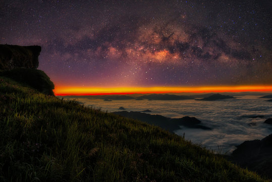Milky way galaxy with stars and morning light on Phu Chi Fa mountain, Chiang Rai, Thailand