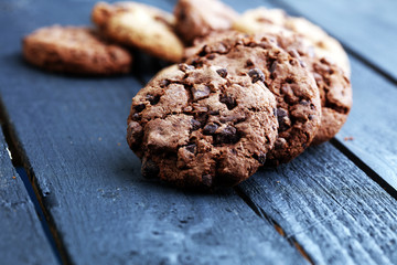Chocolate cookies on wooden table. Chocolate chip cookies shot