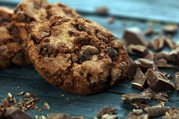 Chocolate cookies on wooden table. Chocolate chip cookies shot