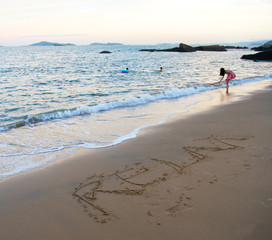 Hand drawn of "RELAX"  on the beach