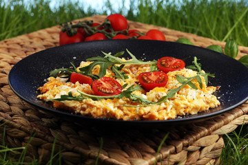 Traditional breakfast - fried eggs,ruccola, tommato- - diet concept scrambled eggs