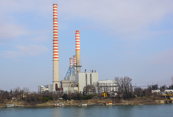 Obraz premium Industrial chimney urban scenery near at power plant