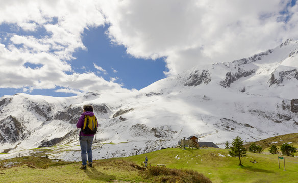 hiker in the Pyrenees mountains in spring with snow