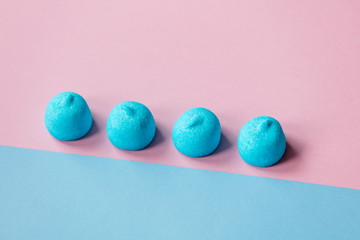 photo of blue marshmallows on the wonderful colorful background in pop art style