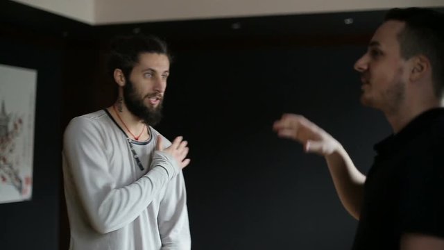 Wushu coach shows the student's reception