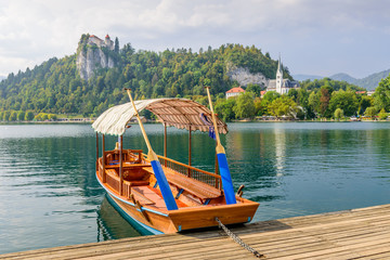 Naklejka na ściany i meble Lake Bled (Blejsko jezero) is a glacial lake in the Julian Alps in northwestern Slovenia, where it adjoins the town of Bled and is overlooked by Bled Castle. 