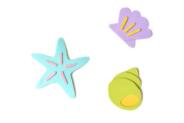 Seashells and starfish paper cut on white background - isolated