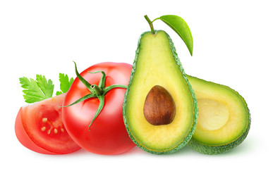 Isolated vegetables. Fresh avocado fruit cut in half and tomatoes isolated on white background with clipping path