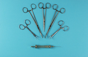 Surgical Instruments on blue background.