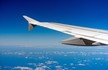 Fototapeta na wymiar Wing of an airplane, view from window.