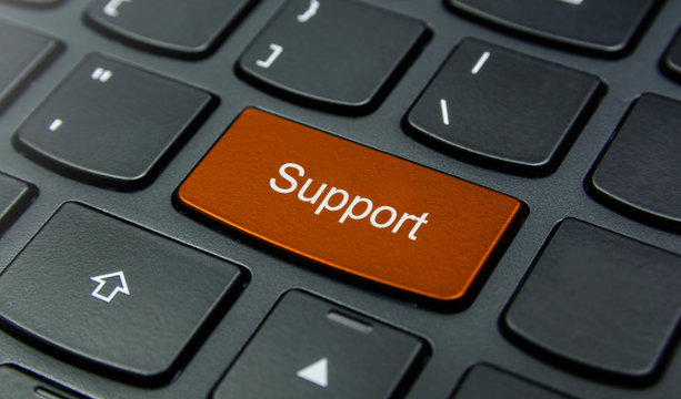 Close-up the Support button on the keyboard and have Orange color button isolate black keyboard