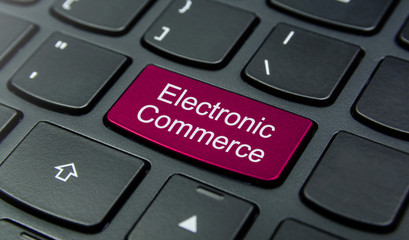 Close-up the Electronic Commerce button on the keyboard and have Pink color button isolate black keyboard