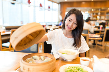 Woman enjoy in chinese restaurant