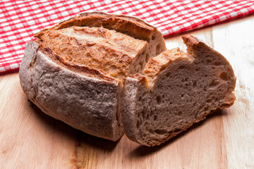 Rustic bread with red kitchen Towels. Country house style. Authentically.