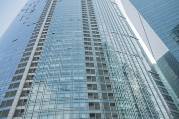 Fototapeta na wymiar Skyscrapers with glass facade. Modern buildings in business district. Concepts of economics, financial, future
