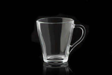 Empty glass cup on a black background