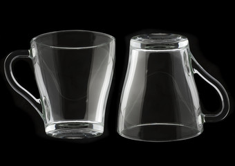 Empty glass cup on a black background